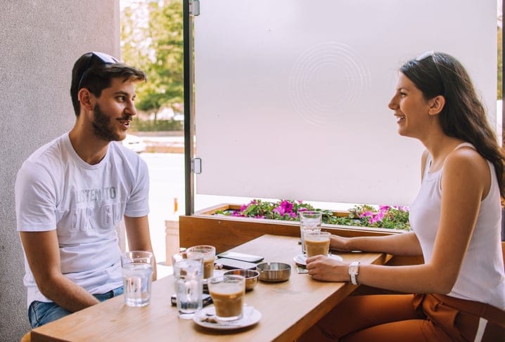 couple having lunch outdoor restaurant