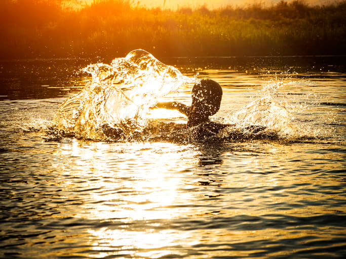 woman swimming in a river