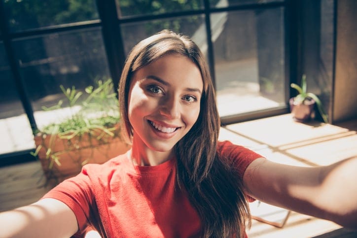 woman facing camera smiling