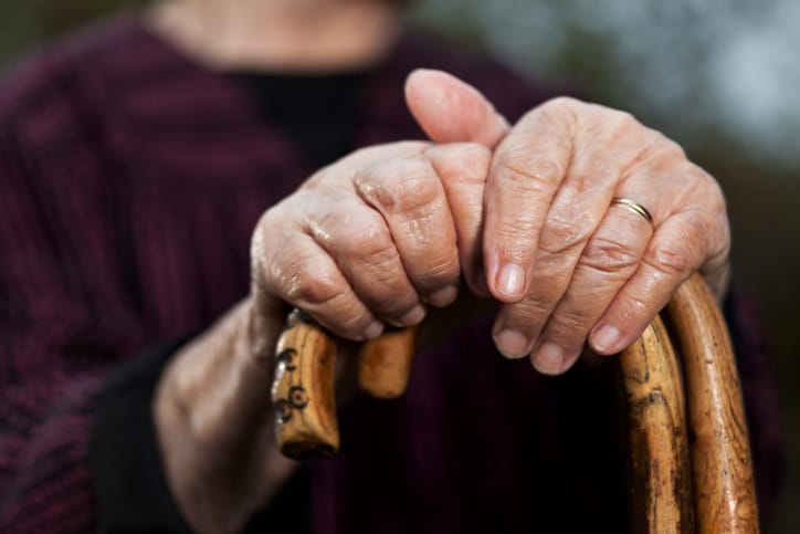old lady with a walking stick