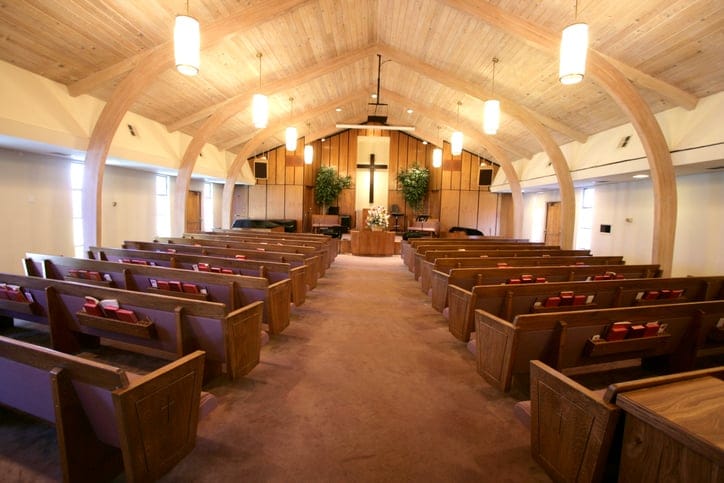 Inside a church, pray.