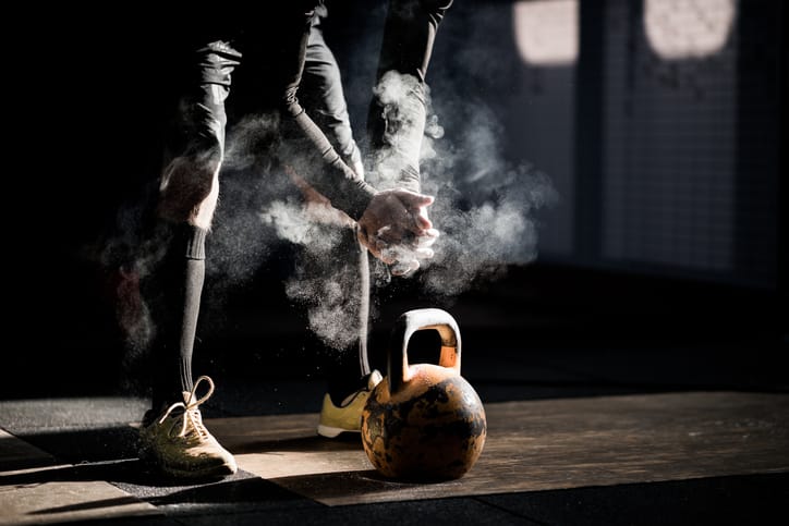 man in gym with barbell