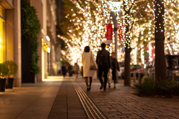 Couple walking outside during Christmas.