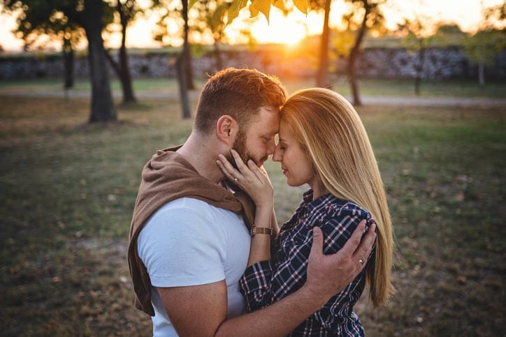 couple kissing in the sunset