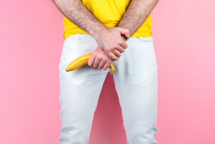 A man holding a banana.
