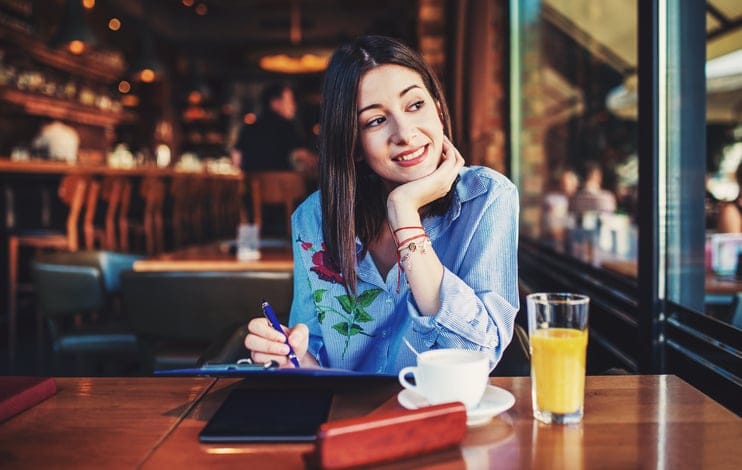 Young student studying in a cafe.