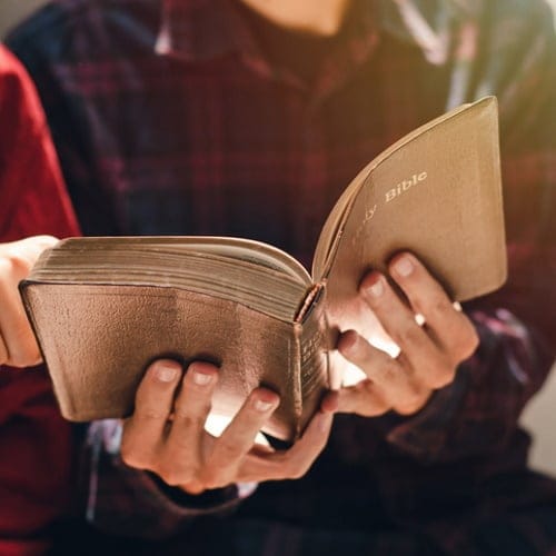 priest holding bible
