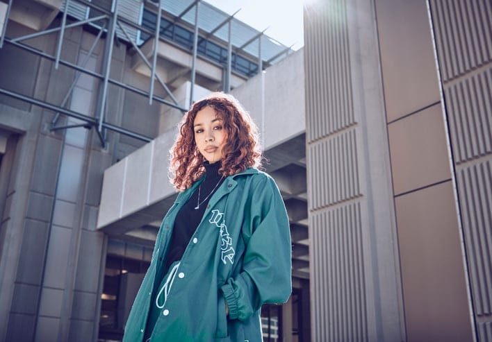 beautiful woman standing in city