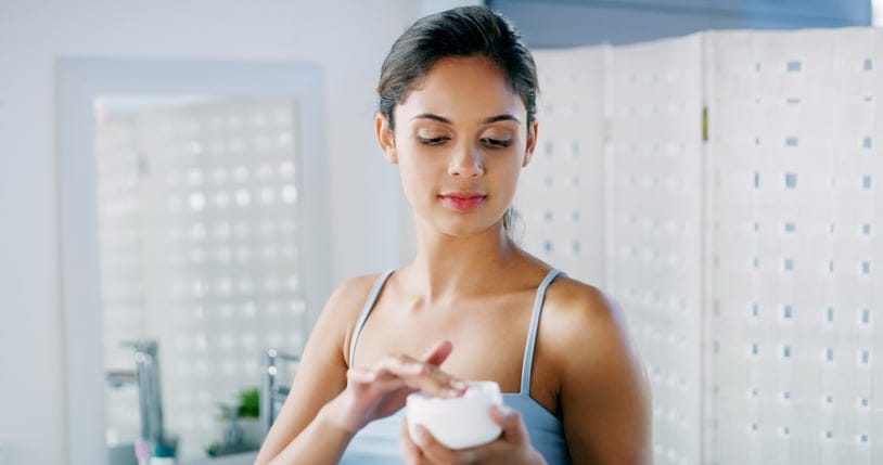 Woman using skincare.