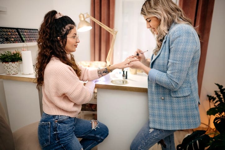 woman getting her nails done