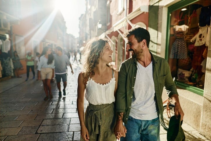 couple walking and holding hands