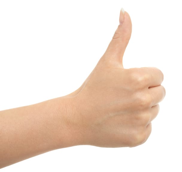 Woman's hand giving the thumb up.
