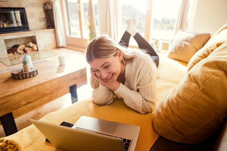 woman looking at the laptop adoringly