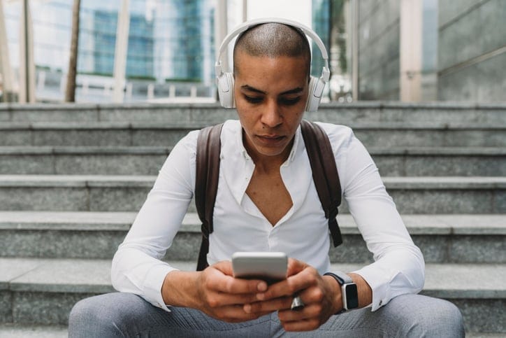 black man steps texting