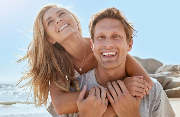 Loving young couple enjoying a day at the beach.