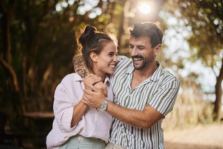 couple holding each other in the park