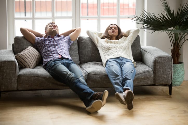 couple sitting relaxing on the sofa