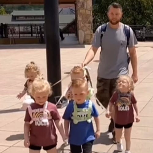dad with kids on leash