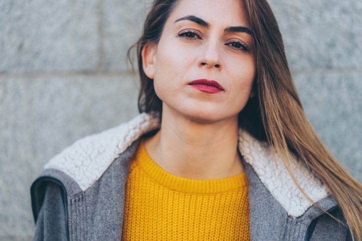 woman serious looking at the camera