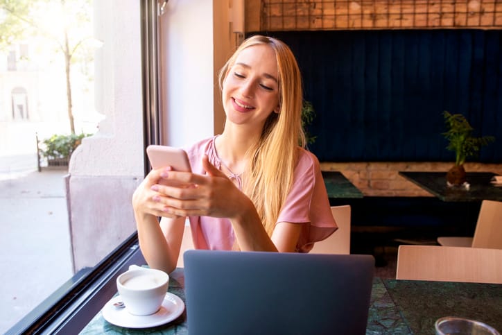 Young woman using her mobile phone.