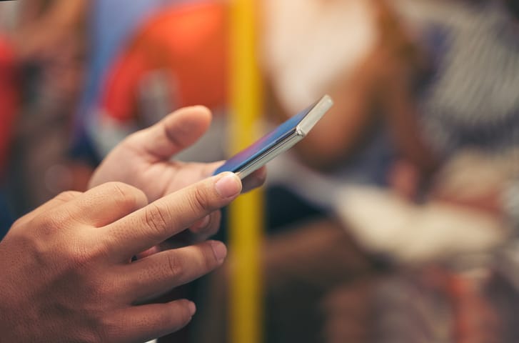 man holding mobile phone