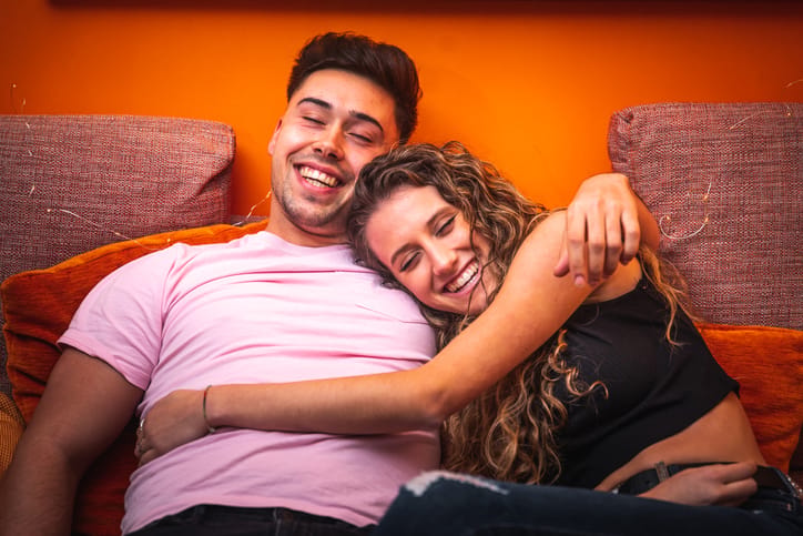 young happy smiling couple sitting