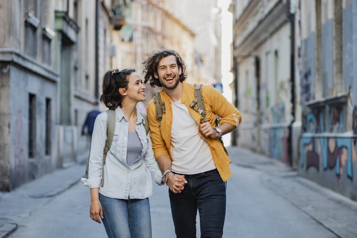 couple holding hands on vacation