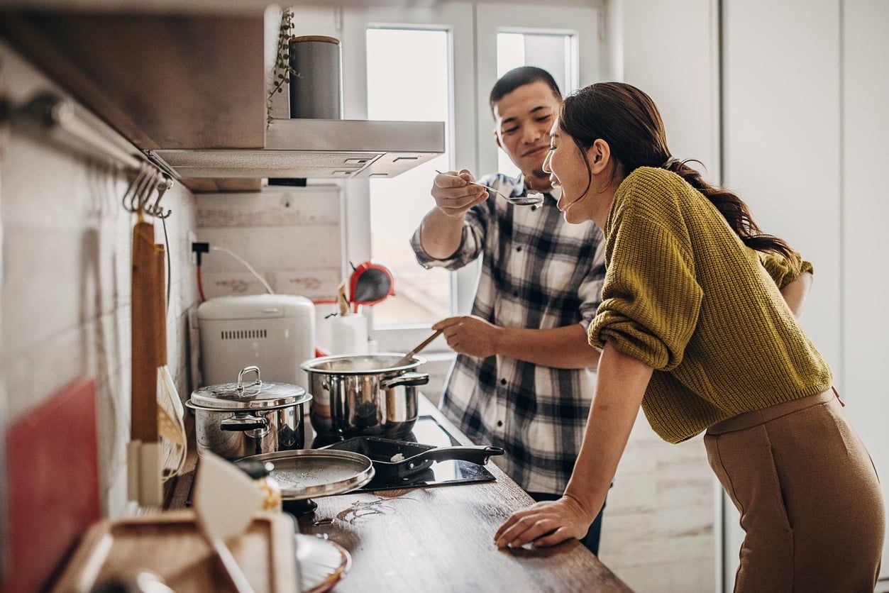 Man cooking for his wife.