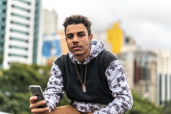 guy using phone in city