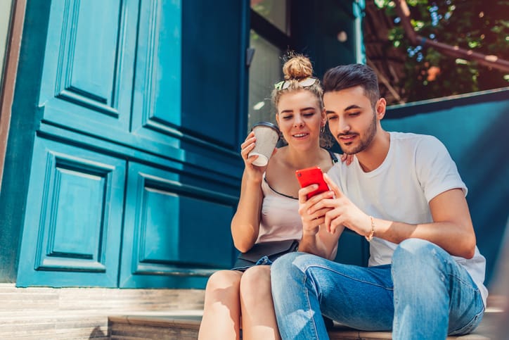 couple sitting outdoors on stoop