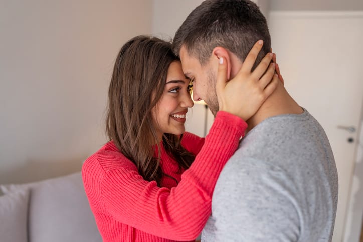 happy couple embracing closely