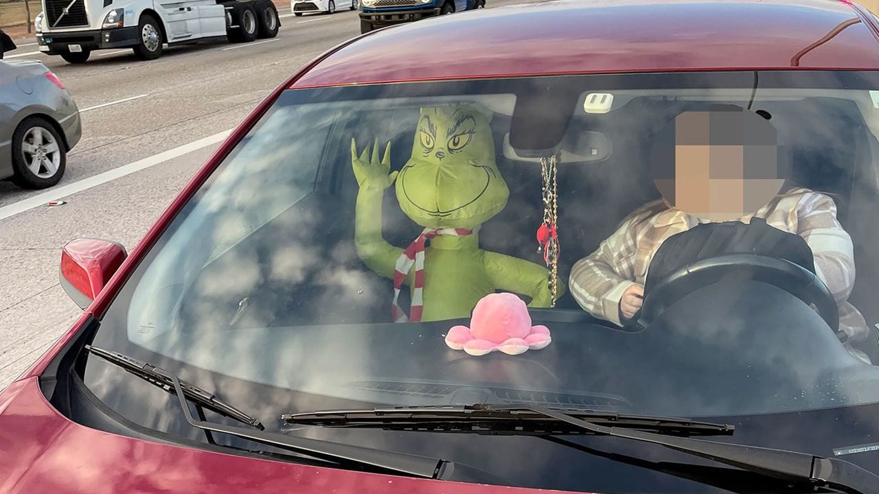 inflatable grinch HOV passenger