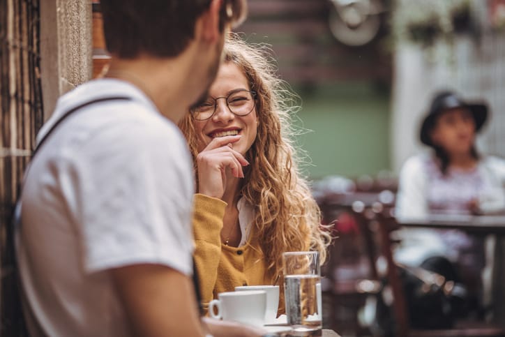 girl laughing at flirting guy