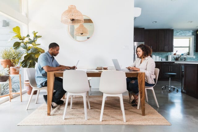 couple working at dining table