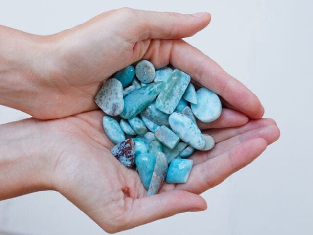 Stones in the palm of a woman's hand. 