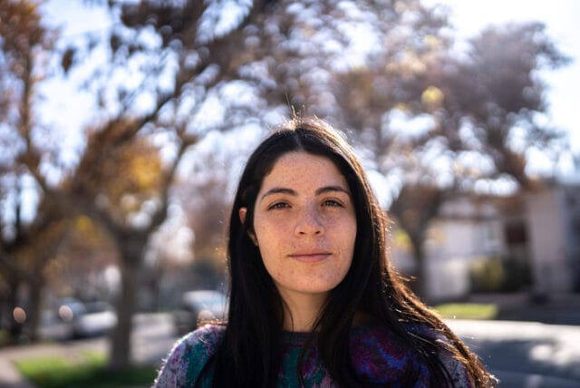 smiling brunette woman in sun