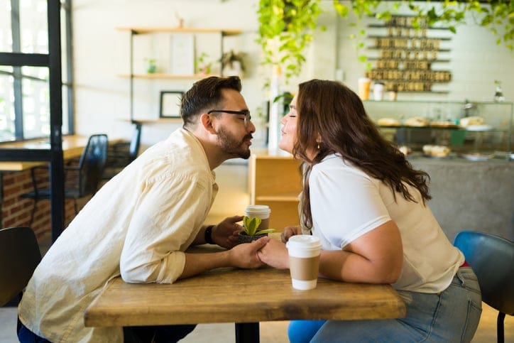 kissing couple in restaurant