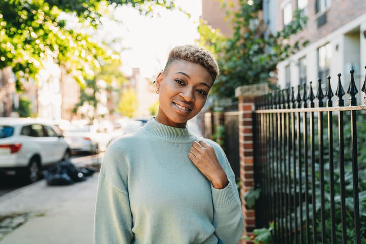 smiling woman on sunny street