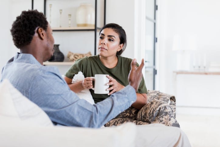 couple having an argument on couch