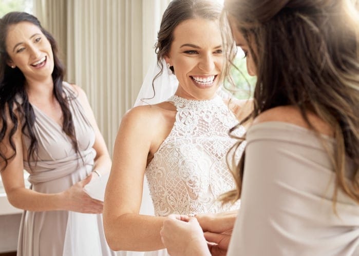 Smiling bride with bridesmaids.