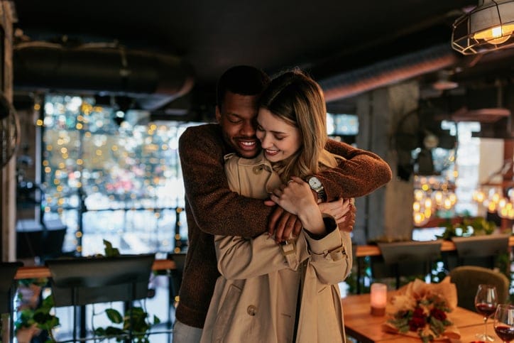 couple embracing at restaurant
