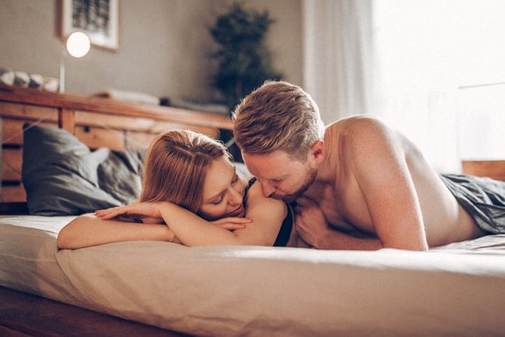 couple sharing intimate moment in bed