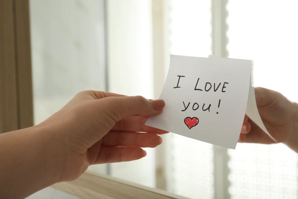 Woman reads a love note.