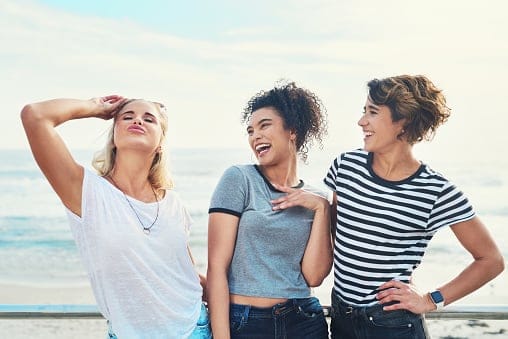 Girls laughing out loud in a dramatic manner