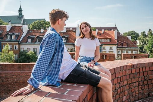couple chatting on rooftop