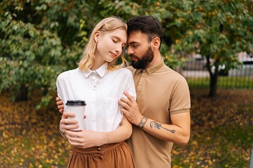 couple embracing outside