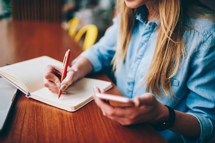 Woman writing a note. 