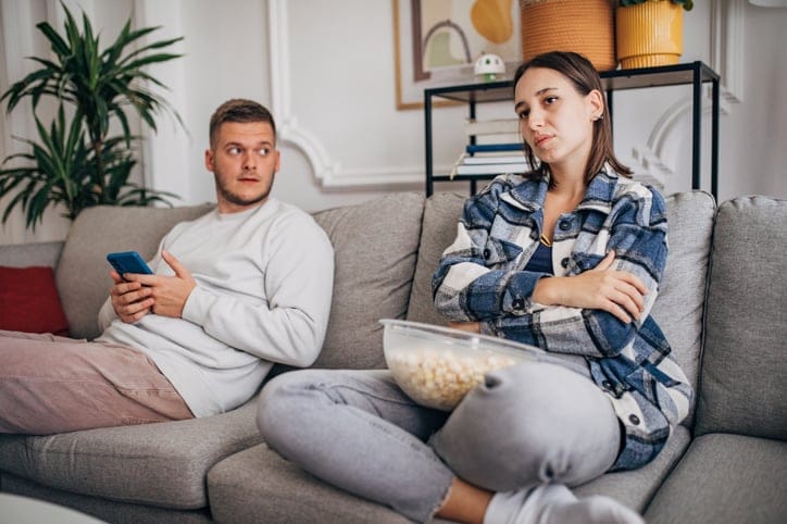 couple having argument on the couch