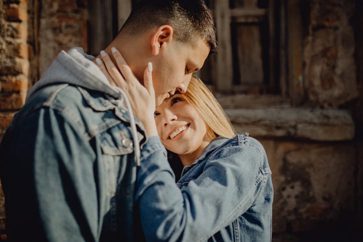 young woman showing boyfriend physical affection