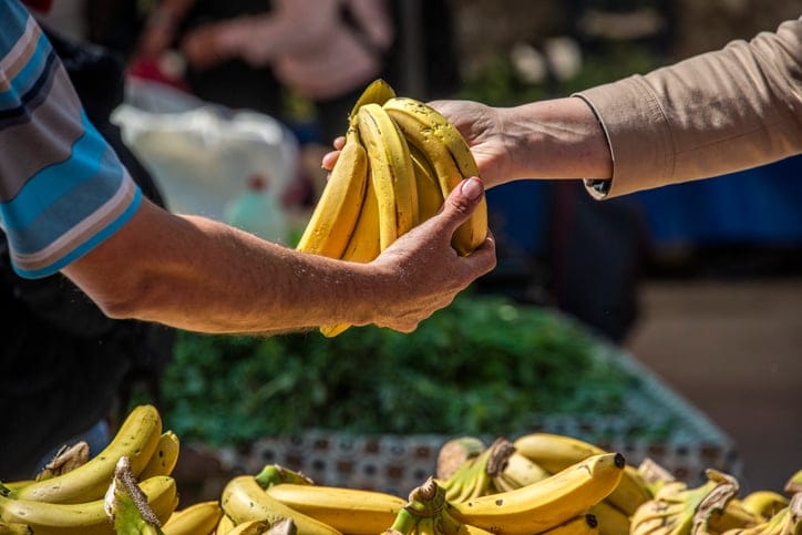 Buying bananas at the store.